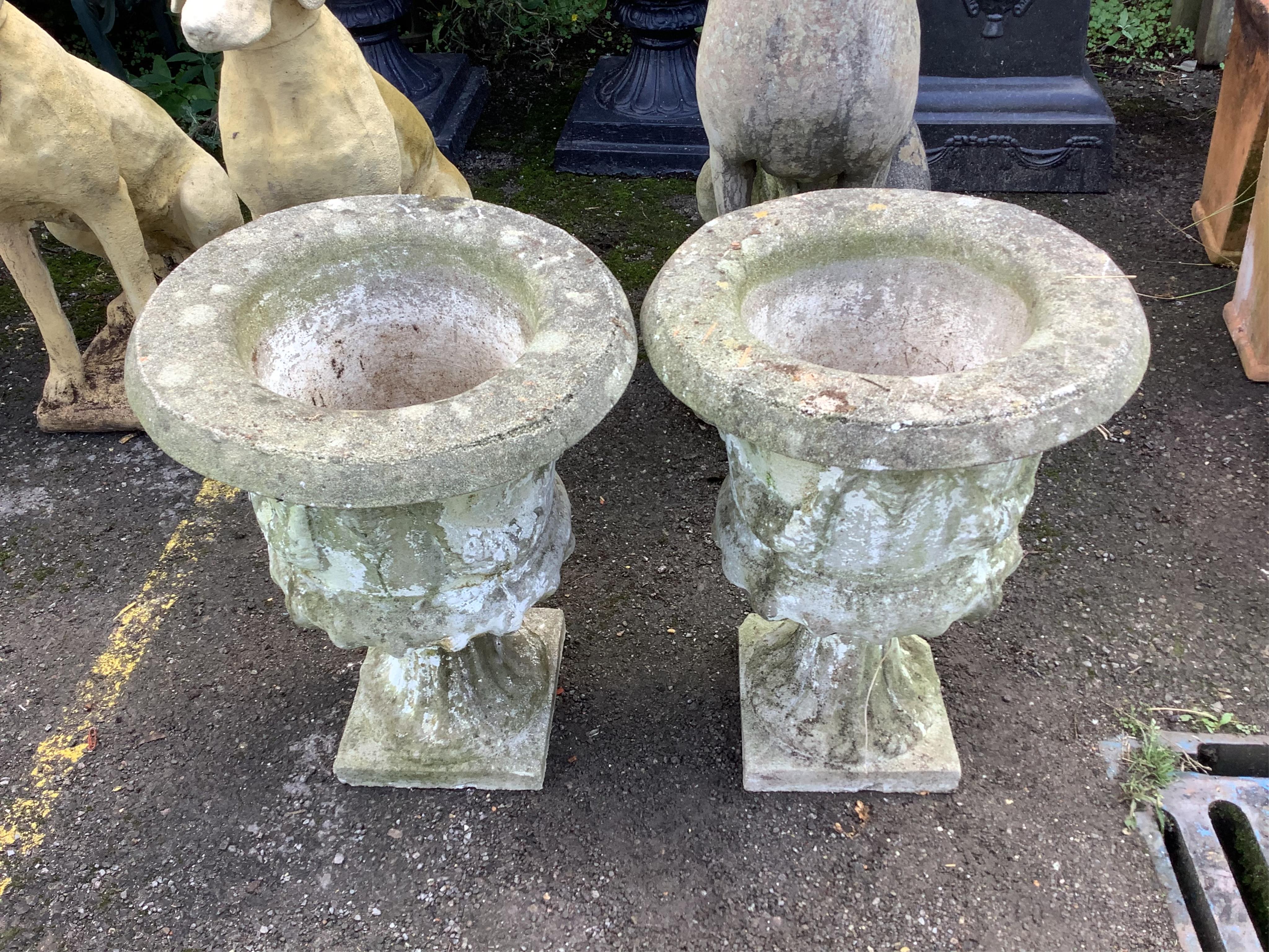 A pair of reconstituted stone garden urns, height 55cm and three assorted marble urns. Condition - all weathered